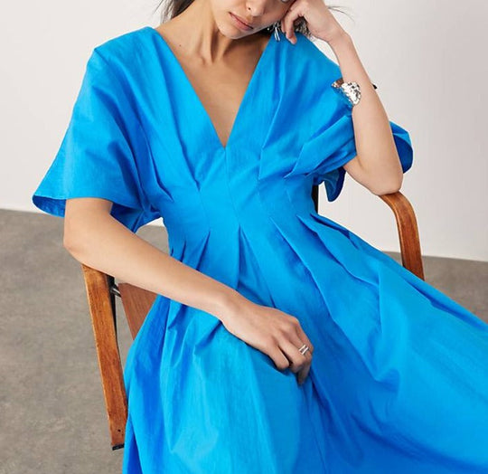 Weites Midikleid mit Puffärmeln | Plissee